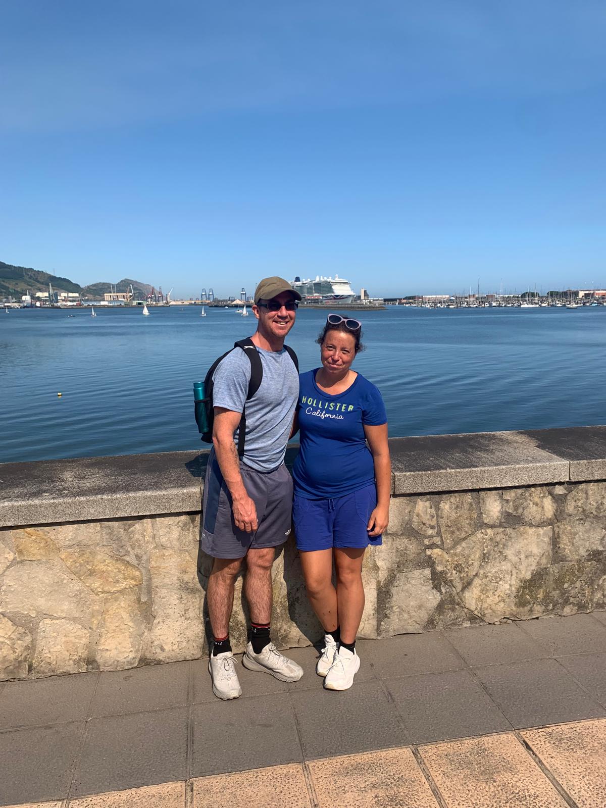 Kirstyn and Glen by the harbour on a sunny day
